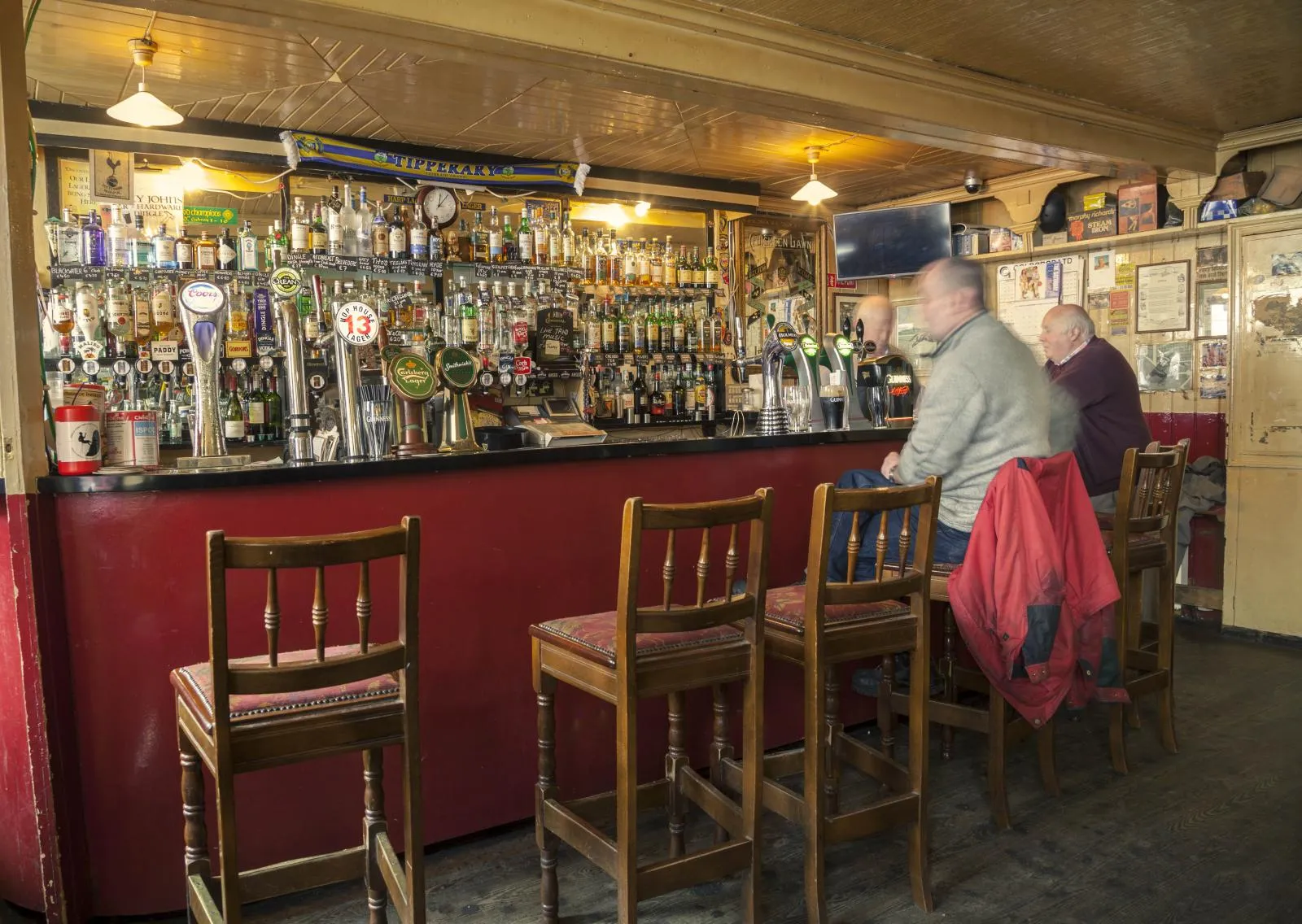 The bar at Foxy John's with locals chatting over a pint