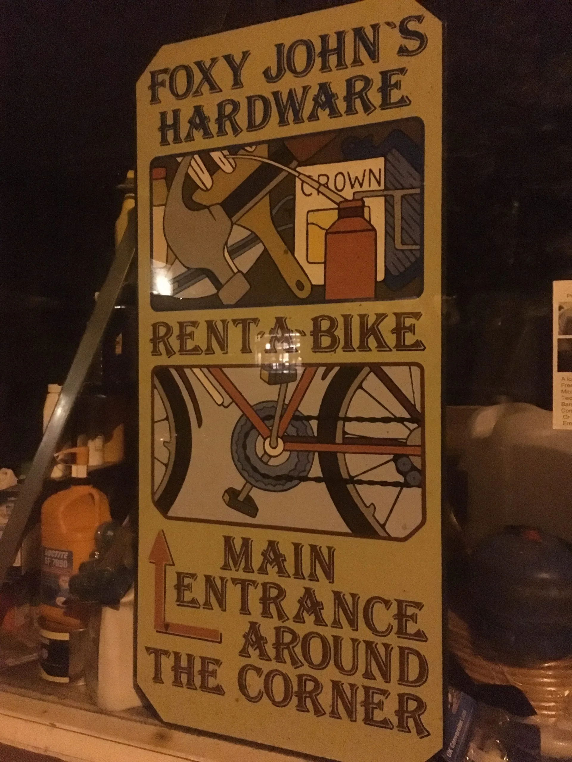 Foxy John's sign showing Hardware and Rent a Bike services