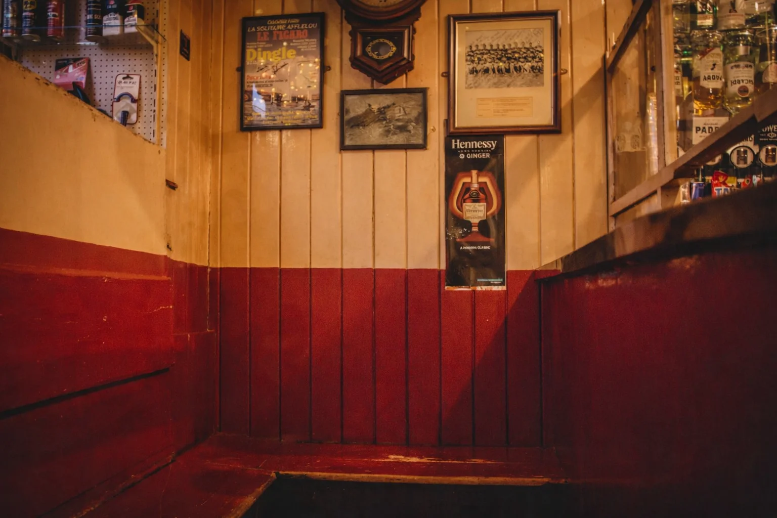 The Snug at Foxy John's - a narrow wooden corner with red and yellow walls